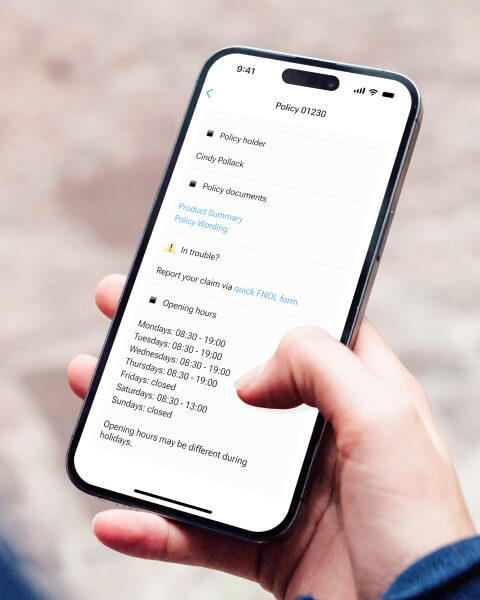 A hand holding an iPhone with Fast claims screen