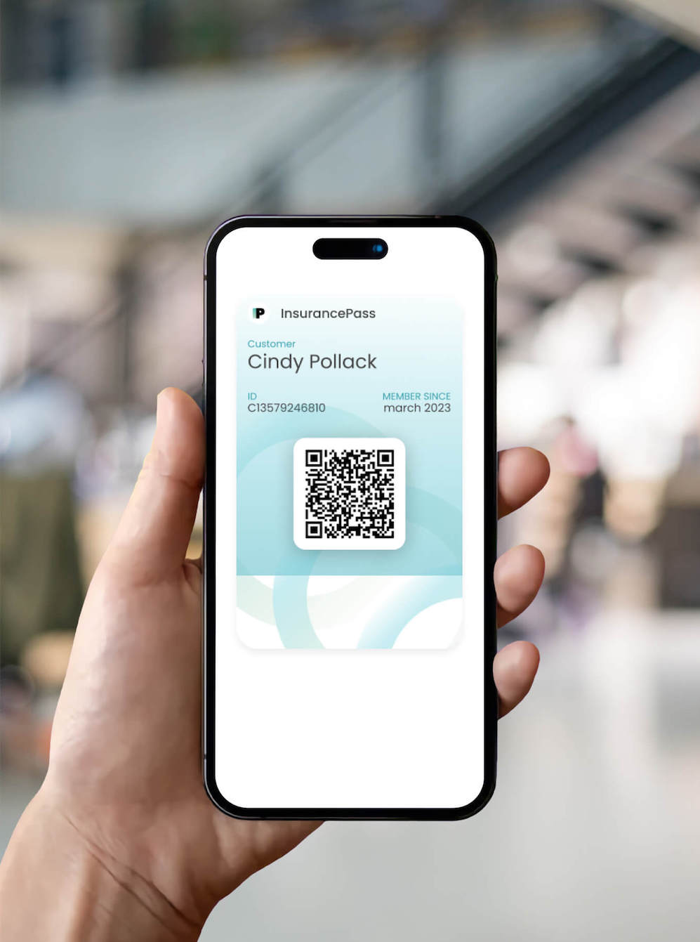 A hand holding iPhone with InsurancePass open